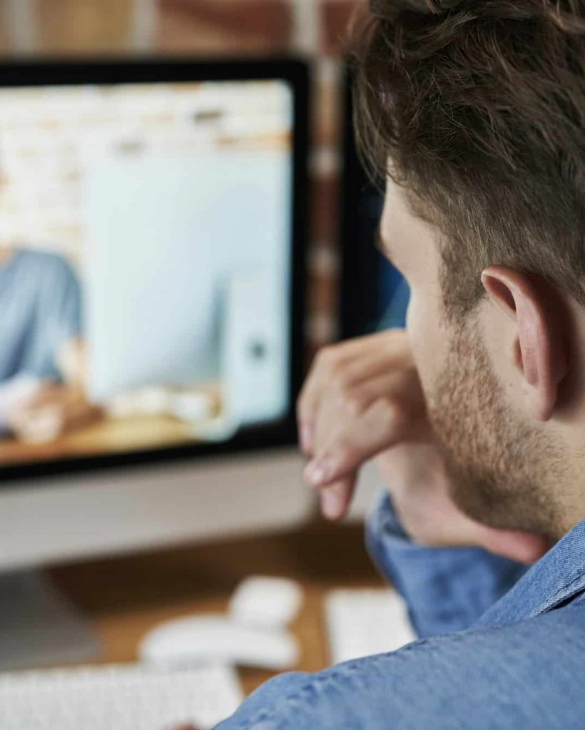 Adult man is taking an online management course